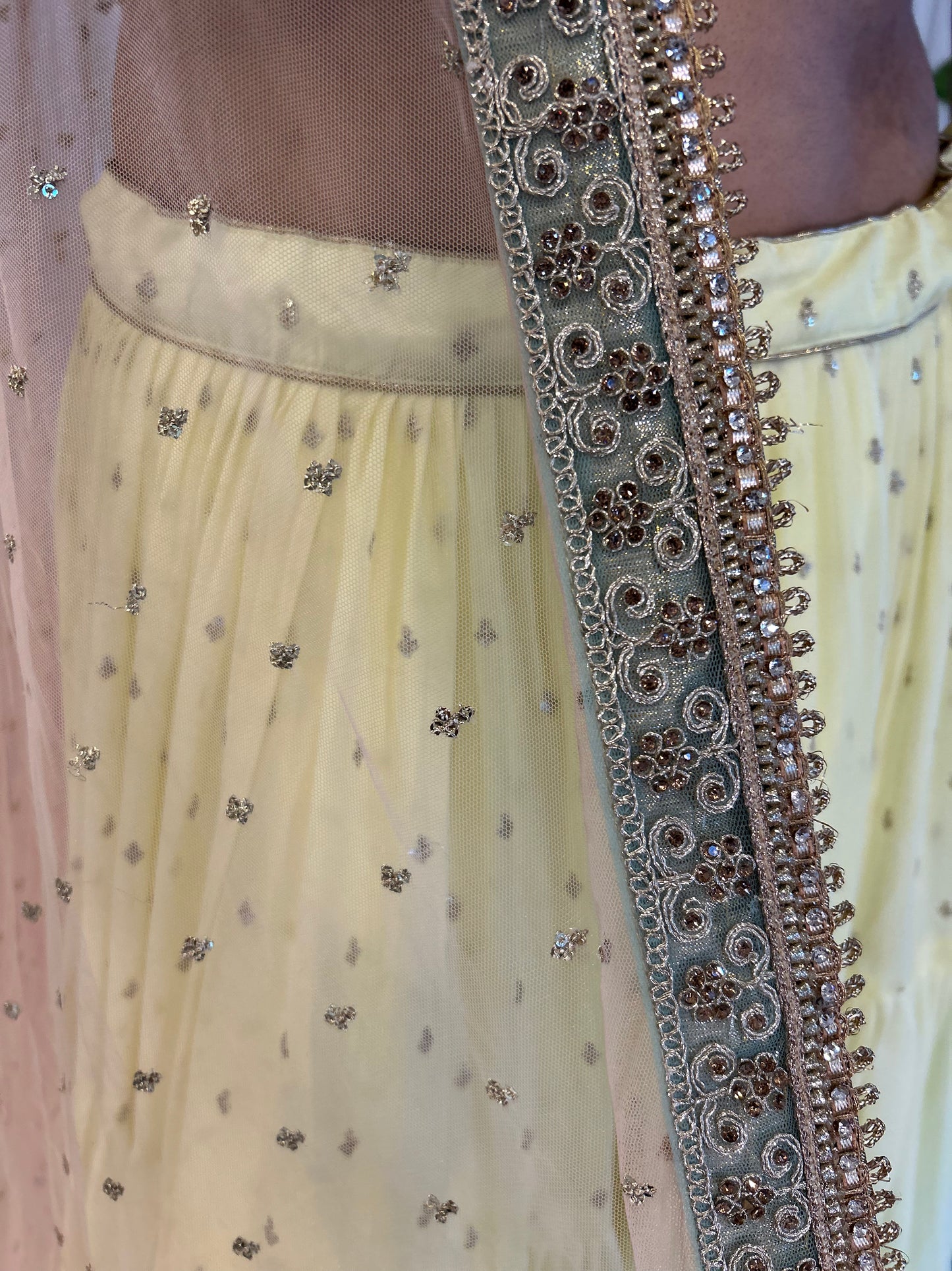 Light Lemon Layered Lehenga with Heavy blouse and Net Dupatta
